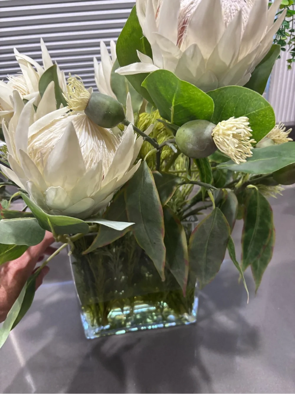 Allstate living Cream Protea Faux Floral Arrangement in Clear Glass Vase
